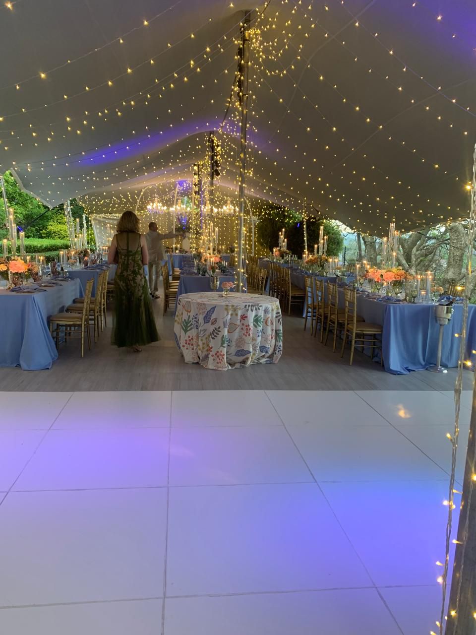 Outdoor event setup under decorative lighting